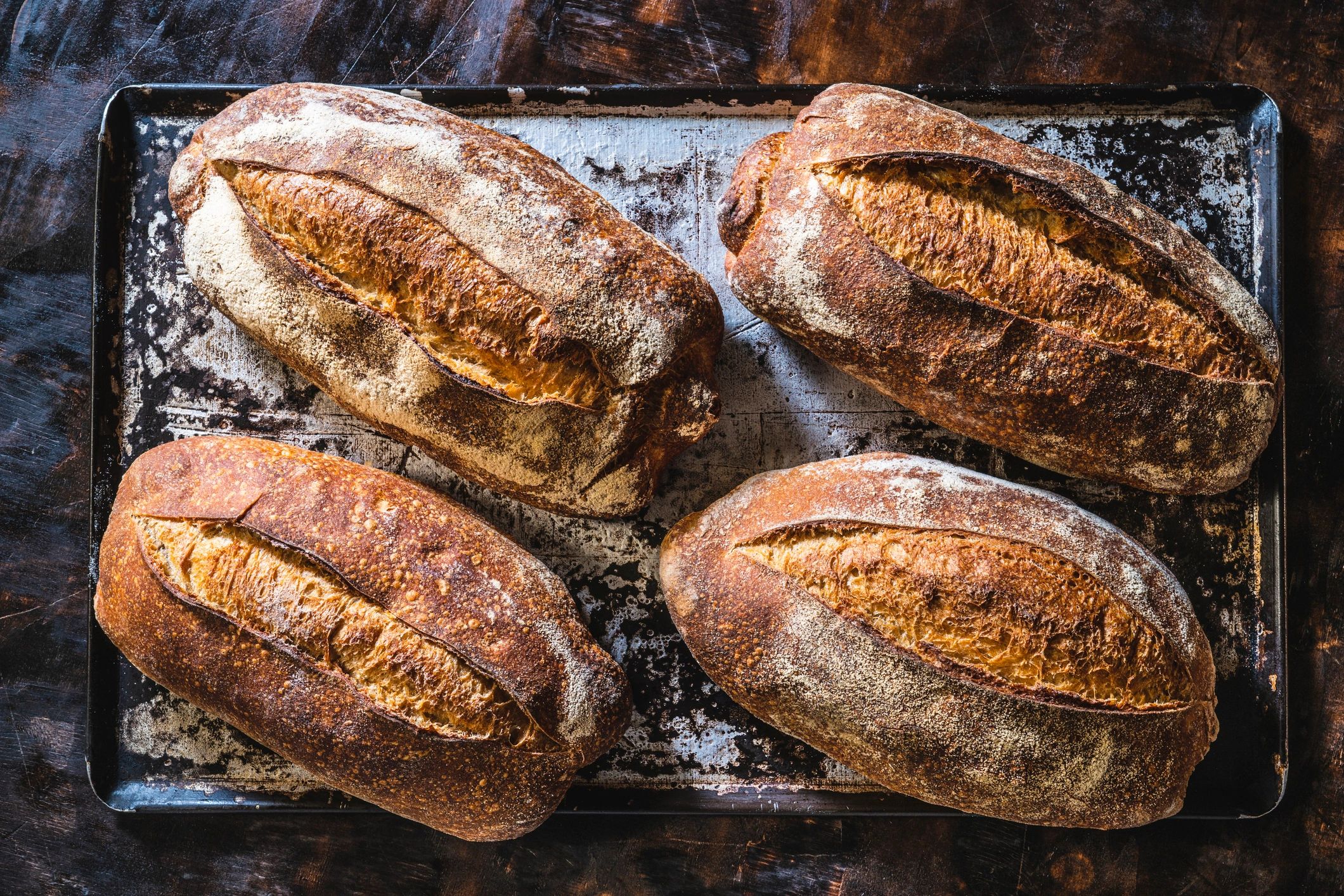 artisan sourdough bread loaf on wooden board